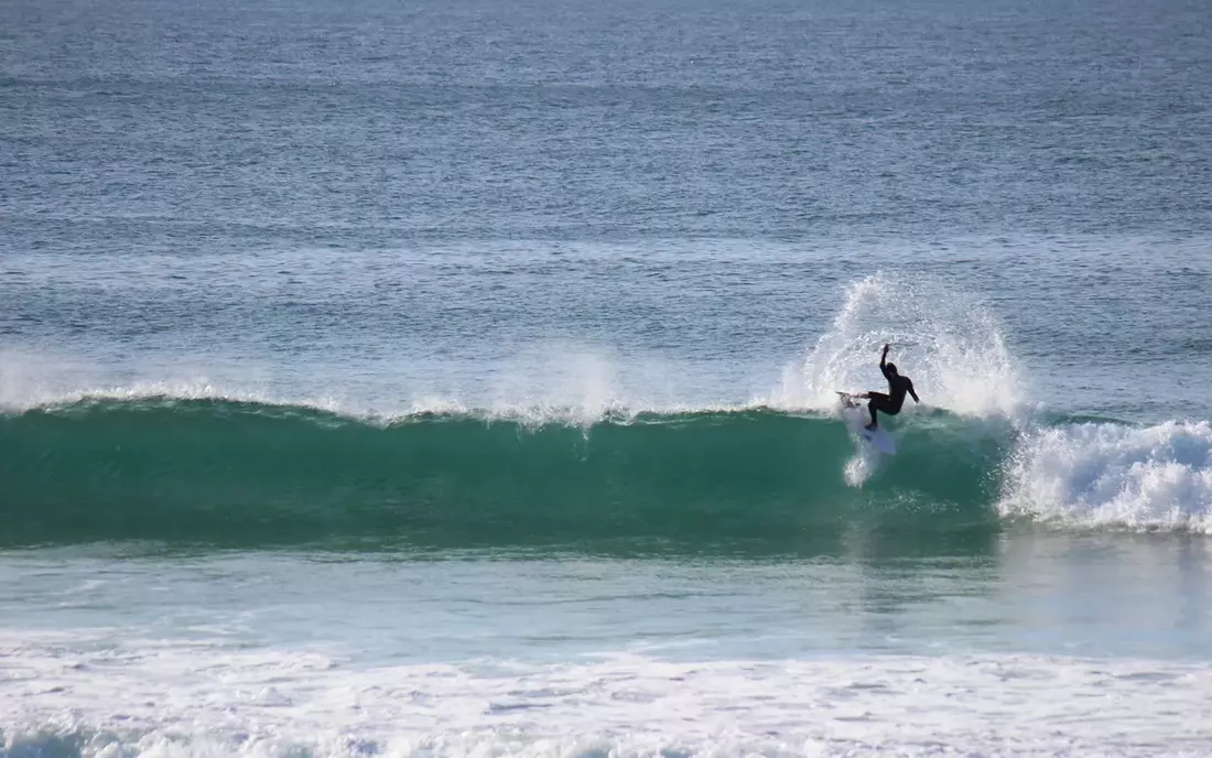 surfer surfing in galicia