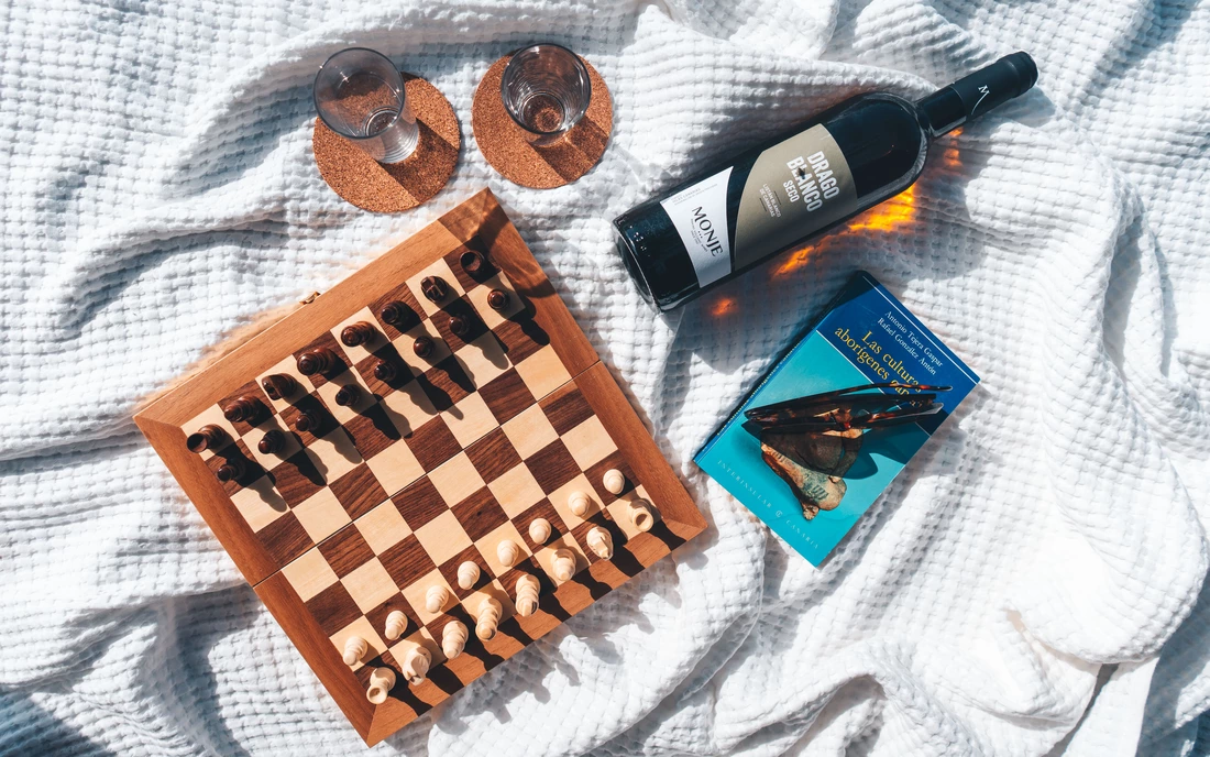 Surf camp Tenerife on the Canary Islands relax and play chess with a glass of wine