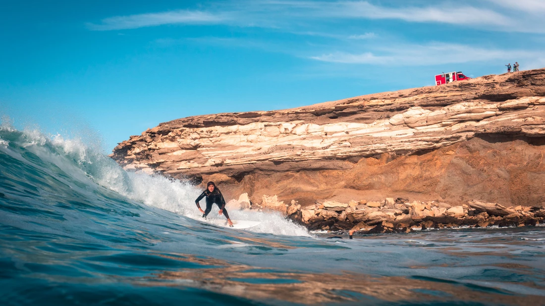 surfer surfing a wave in fuerteventura