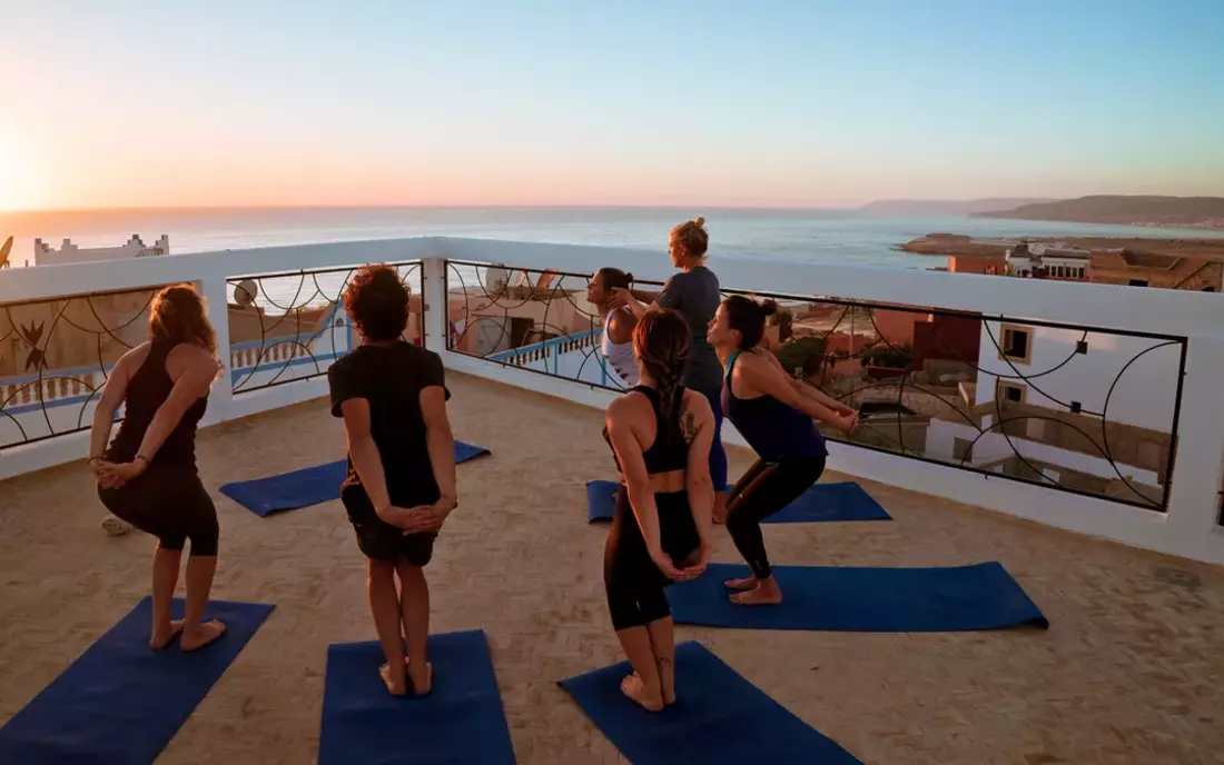 yoga session at the terrace of surf camp morocco