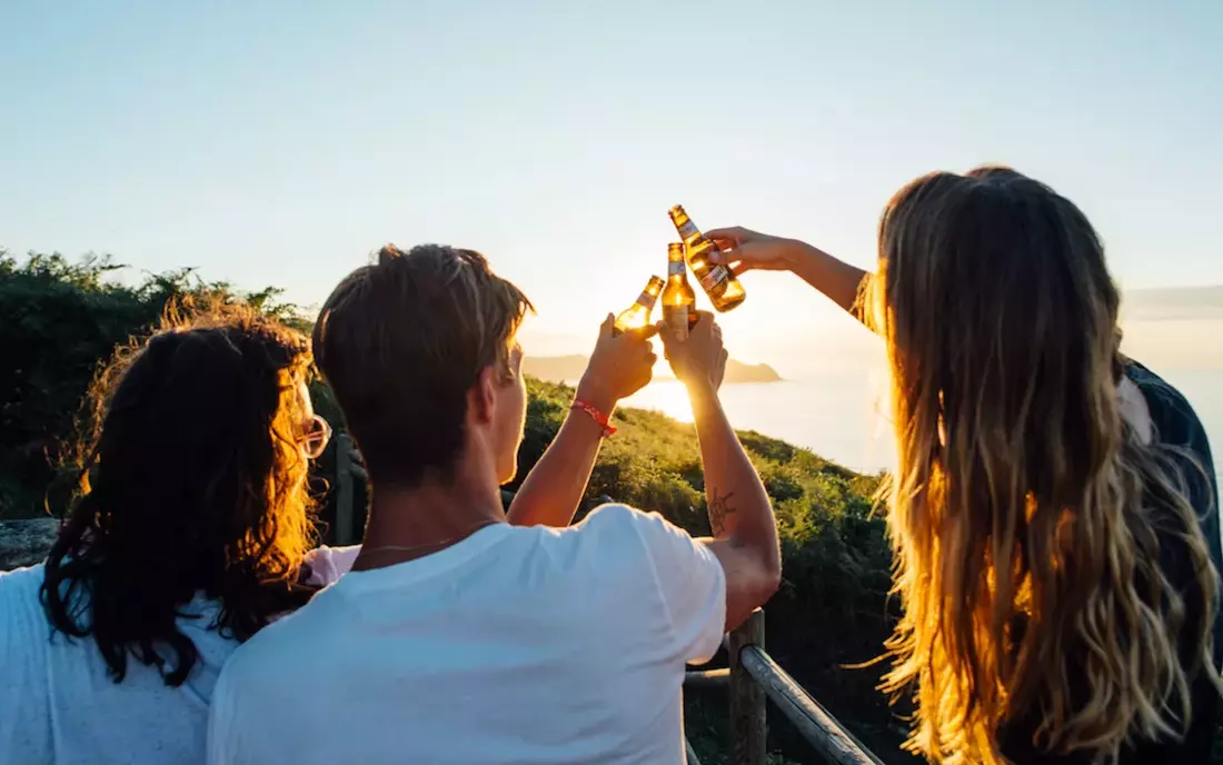 surf camp zarautz guests with sunset drinks