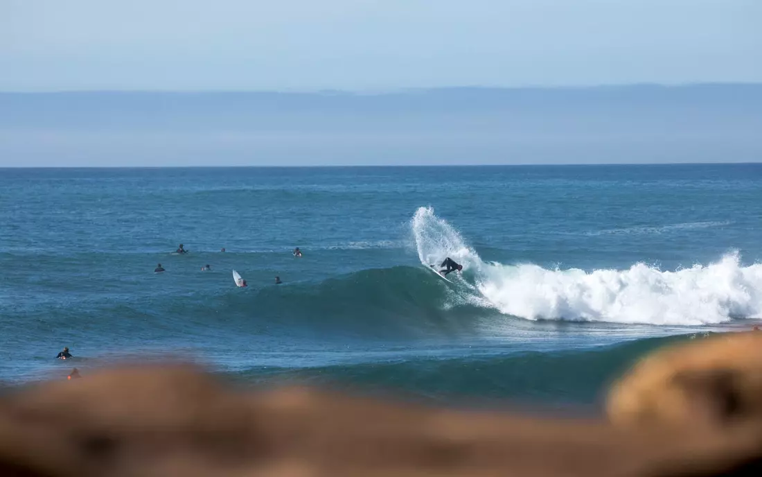 surfer surfing wave in the algarve