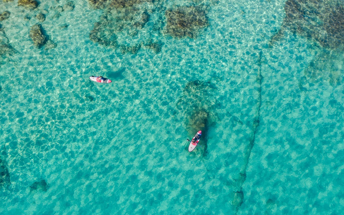 SUP tours in azure water.