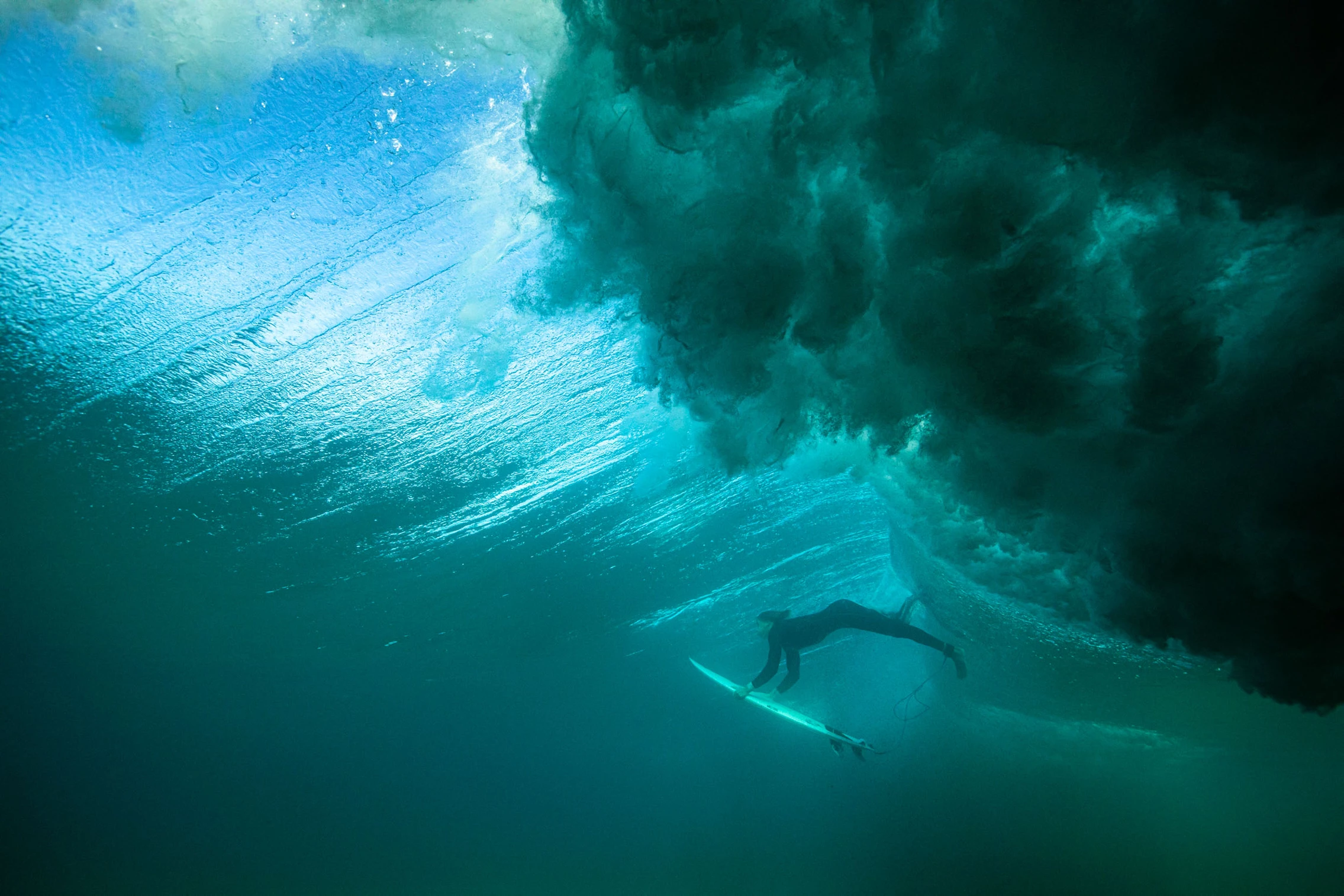 surfer diving through wave on fuerteventura