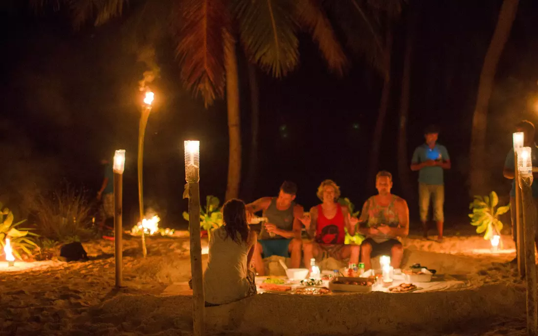 Surfing in the Maldives and candle light dinner on the beach