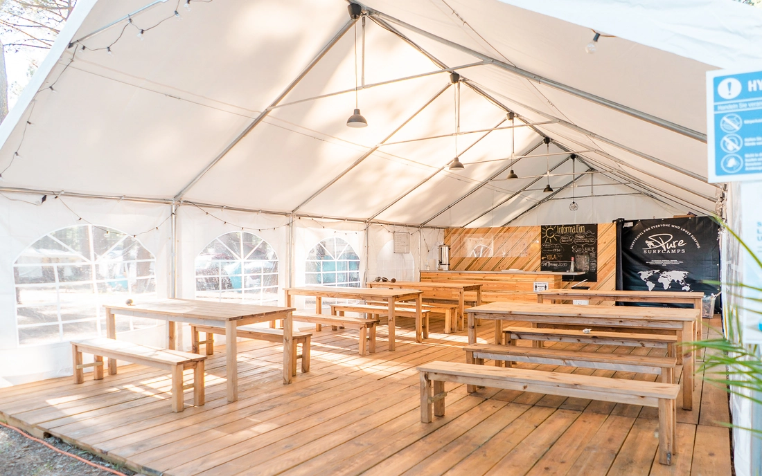 The cozy dining and lounge area of the surf camp