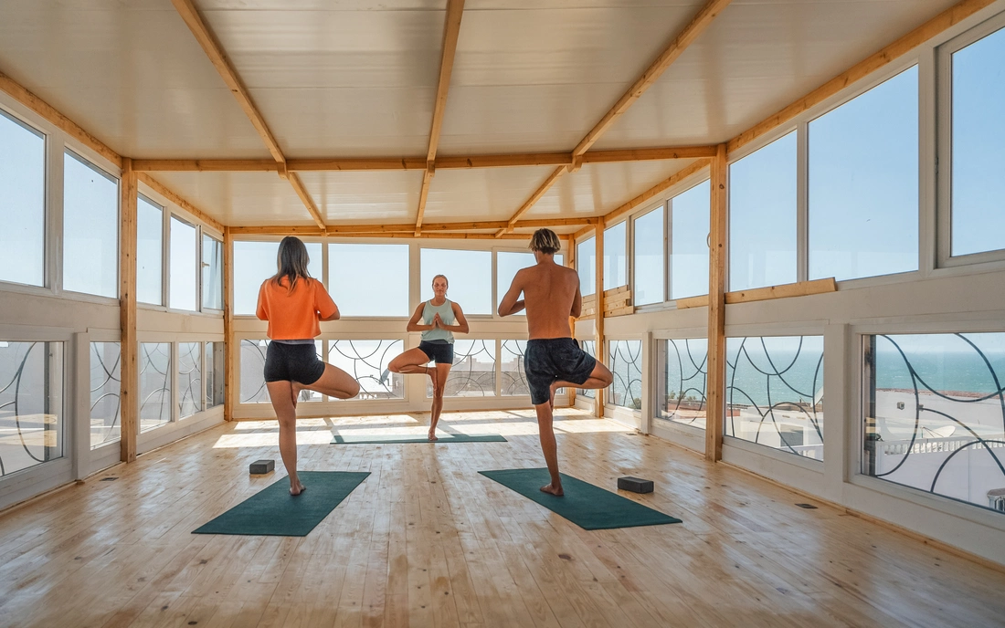 Practice yoga on the terrace at a pleasant temperature