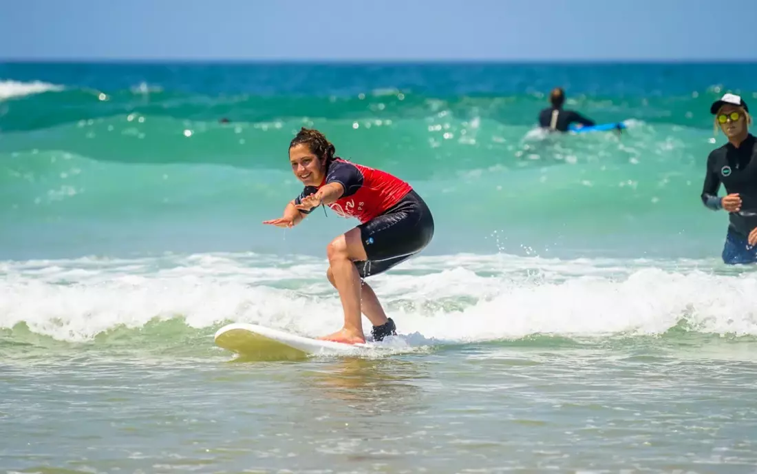 surf student learning how to surf