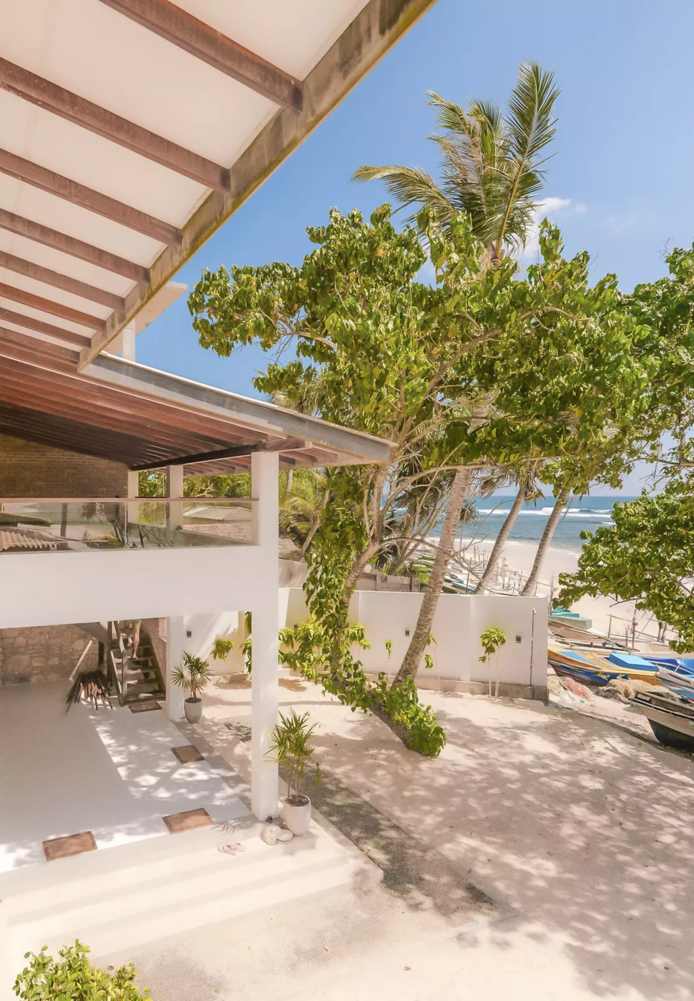 View from the terrace of the garden, beach and sea