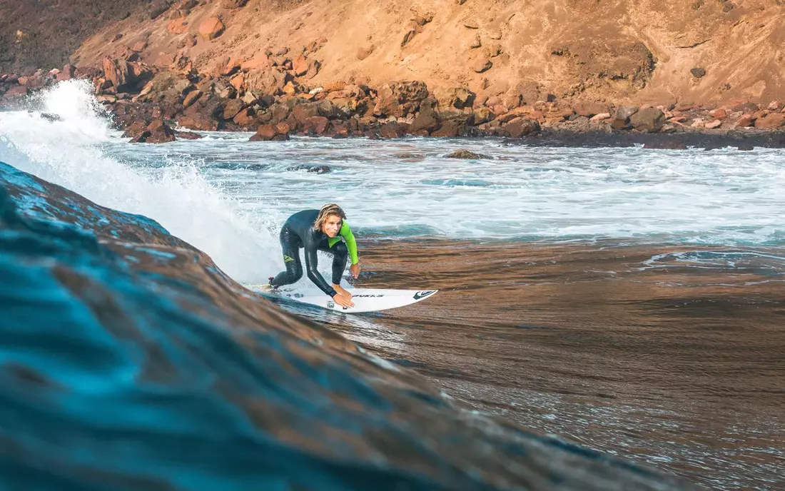 surfer surfing wave on fuerteventura