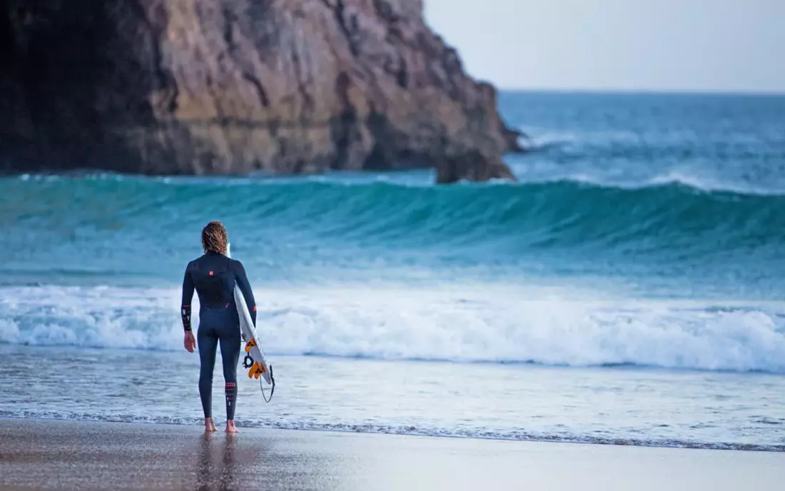 surfer at a beach in the algarve