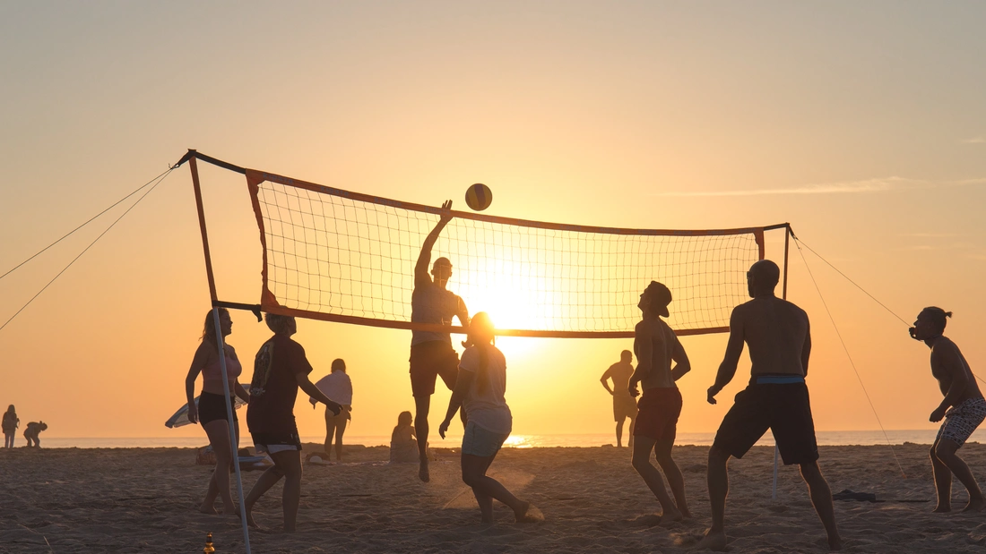 beach volleyball game at surf camp algarve