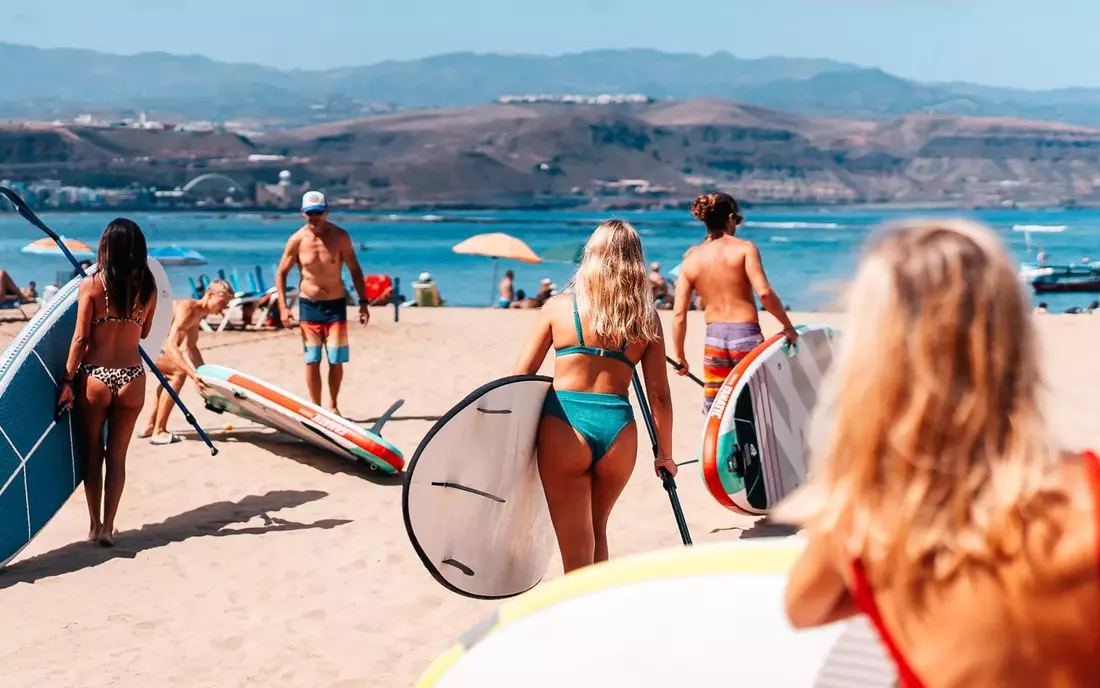 Paddle out to sea with friends