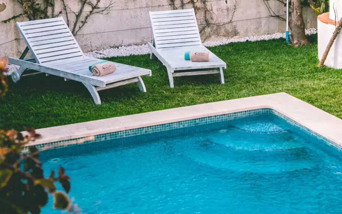 Eco Surflodge Caparica chilling by the pool