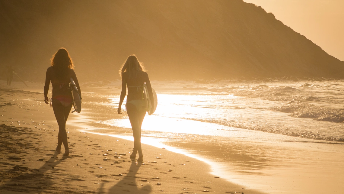 surfer girls sunset