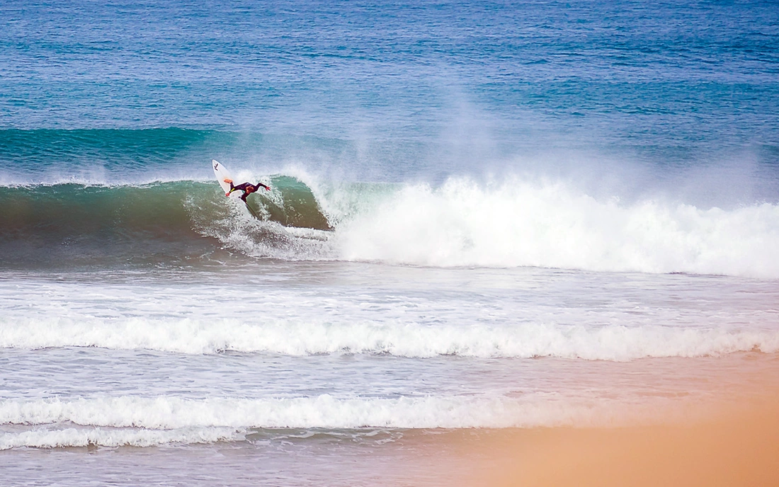 Surfing beach break heavy wave